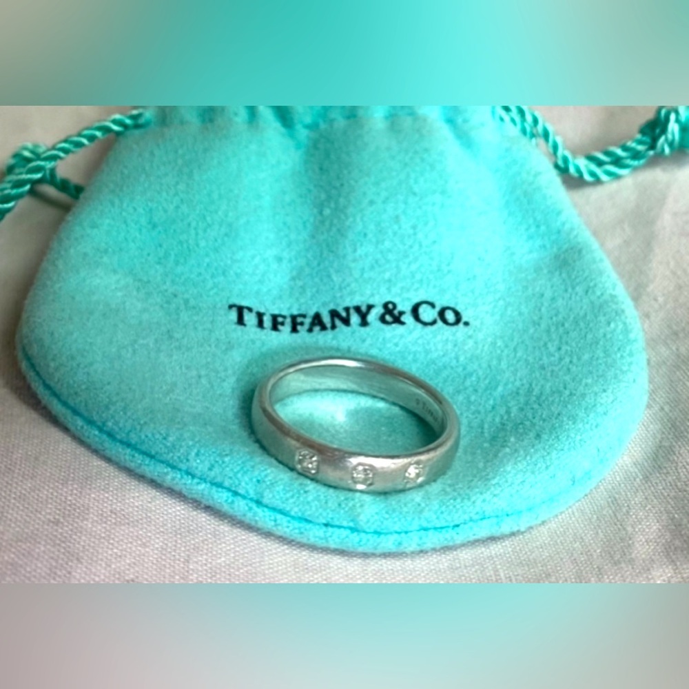 Tiffany & Co. Lucida 3-diamond Platinum comfort fit band. 2 sizes available